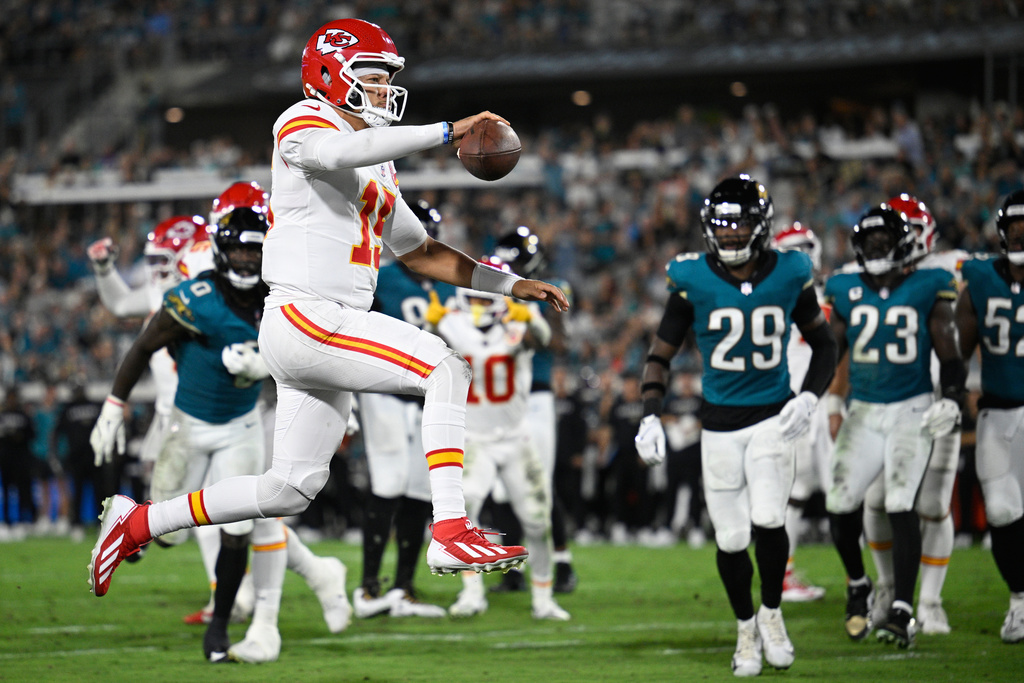 Kansas City Chiefs quarterback Patrick Mahomes celebrates after scoring a touchdown during the first half of an NFL football game against the Jacksonville Jaguars, Monday, Oct. 6, 2025, in Jacksonville, Fla. (AP Photo/Phelan M. Ebenhack)