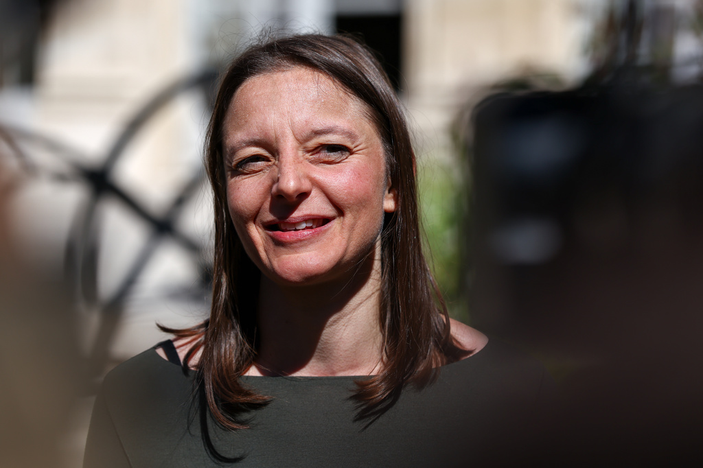 Cecile Kohler, a French national who were freed by Iran with Jacques Paris after three and a half years in detention, speaks to media at the Elysee Palace as they are hosted by French President Emmanuel Macron, in Paris, France, April 8, 2026. (Tom Nicholson/Pool Photo via AP)