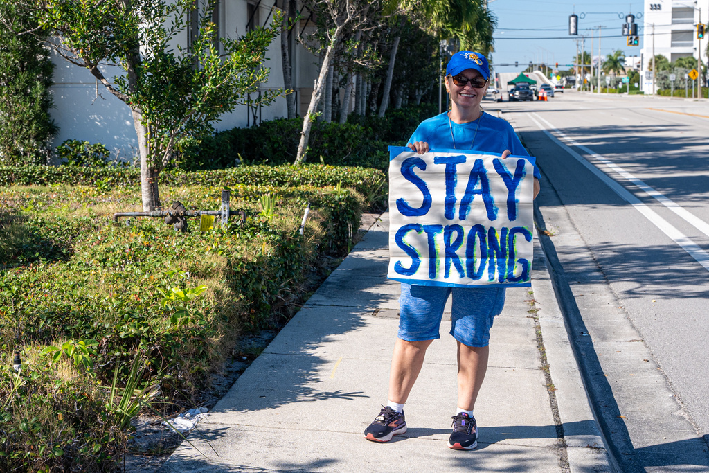 Karen Blake of Ft. Lauderdale, poses with a sign at the "Rally in Support of Ukraine" organized by the Ukrainian Association of Florida as Ukrainian President Volodymyr Zelenskyy meets with U.S. President Donald Trump at Mar-a-Lago in West Palm Beach, Fla., Sunday, Dec. 28, 2025. (AP Photo/Jen Golbeck)