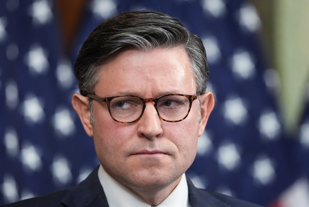 Speaker of the House Mike Johnson, R-La., listens to other GOP leaders as a government shutdown begins its tenth day, in Washington, Friday, Oct. 10, 2025. (AP Photo/J. Scott Applewhite)