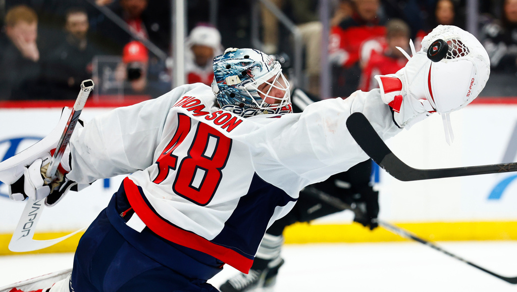 Washington Capitals goaltender Logan Thompson (48) defends against the New Jersey Devils during the second period of an NHL hockey game Saturday, Dec. 27, 2025, in Newark, N.J. (AP Photo/Noah K. Murray)