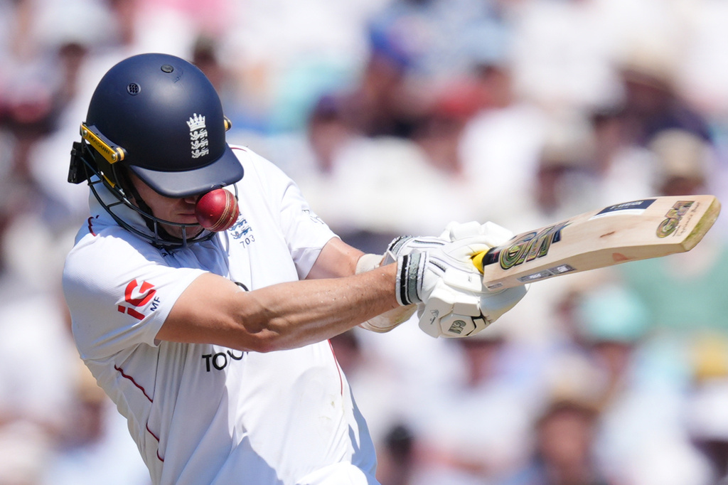 England's Matt Fisher is hit by a bouncer from New Zealand's Will O'Rourke on day three of the second cricket test between England and New Zealand, in London, Friday June 19, 2026. (Ben Whitley/PA via AP)