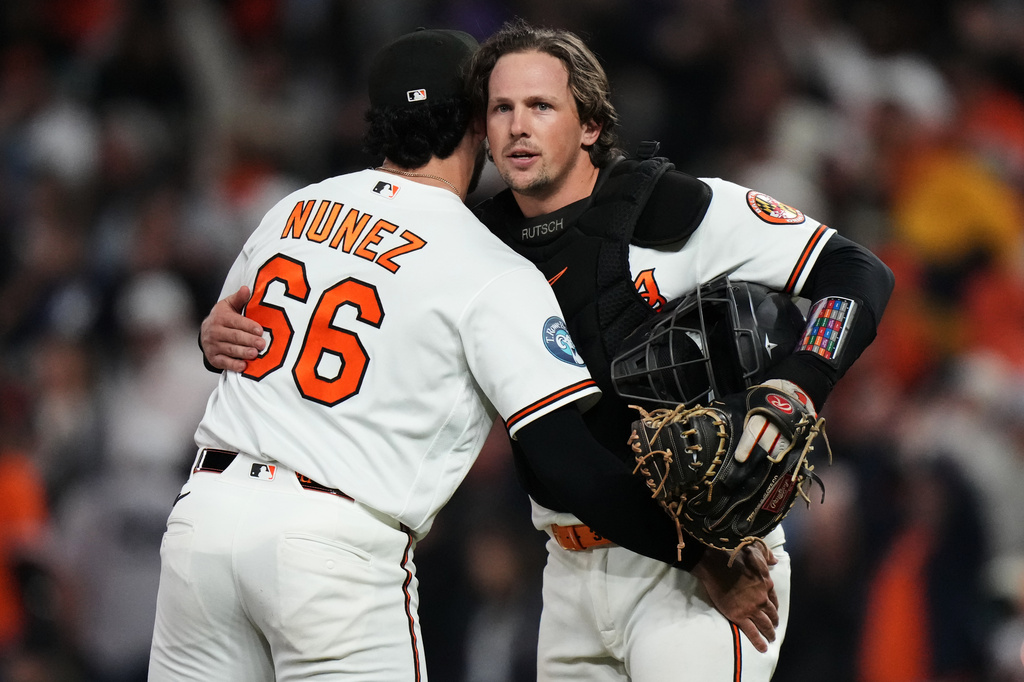 Baltimore Orioles catcher Adley Rutschman, right, and pitcher Anthony Nunez (66) celebrate after their team's victory over the New York Yankees in a baseball game, Monday, May 11, 2026, in Baltimore. (AP Photo/Stephanie Scarbrough)