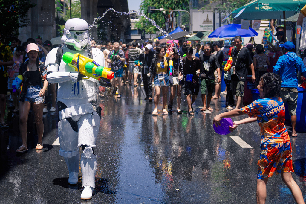 Peoples participate in the Songkran water festival to celebrate the Thai New Year in Bangkok, Thailand, Monday, April 13, 2026. (AP Photo/Arnun Chonmahatrakool)