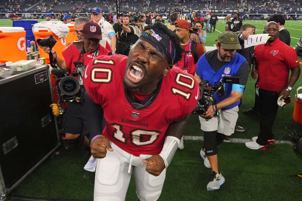 Tampa Bay Buccaneers quarterback Jalon Daniels (10) yells as he leaves the field after beating the Dallas Cowboys in an NFL football game in Arlington, Texas on Thursday, Oct. 8, 2026. (AP Photo/Julio Cortez)