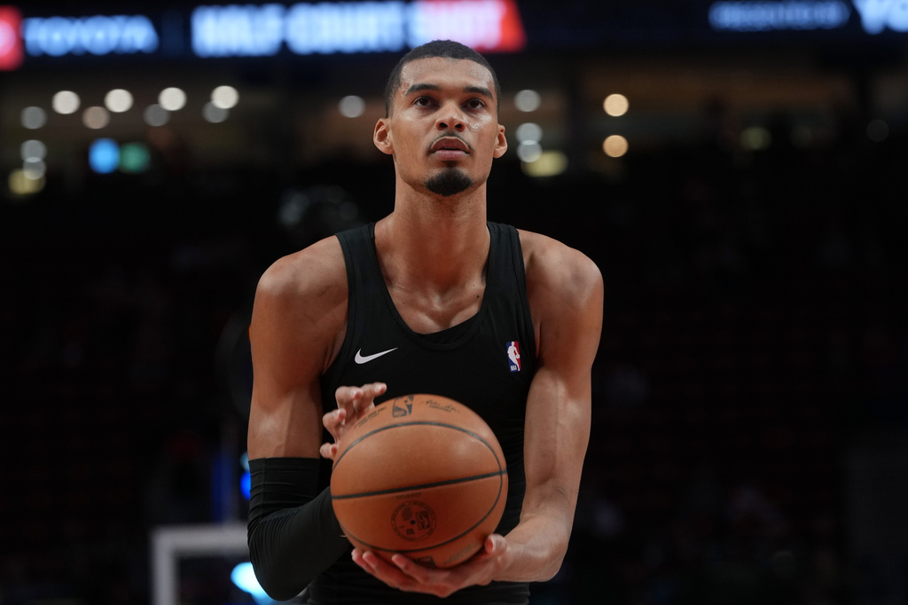San Antonio Spurs forward Victor Wembanyama warms up before Game 3 of a first-round NBA playoffs basketball series against the Portland Trail Blazers in Portland, Ore, Friday, April 24, 2026. (AP Photo/Jenny Kane)