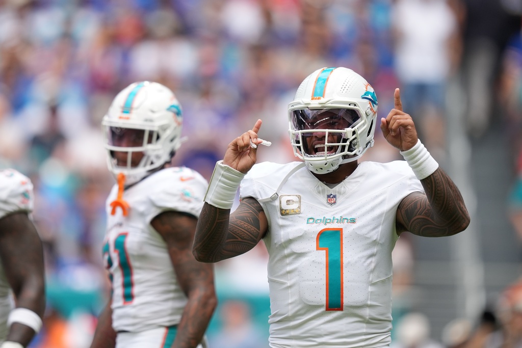 Miami Dolphins quarterback Tua Tagovailoa (1) looks to the sideline during the first half of an NFL football game against the Buffalo Bills, Sunday, Nov. 9, 2025, in Miami Gardens, Fla. (AP Photo/Rebecca Blackwell)