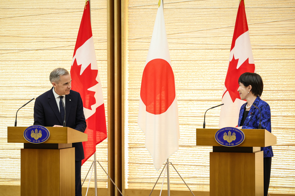 Canada's Prime Minister Mark Carney, left, and Japan's Prime Minister Sanae Takaichi attend a joint press conference in Tokyo, Japan, Friday, March 6, 2026. (Takashi Aoyama/Pool Photo via AP)