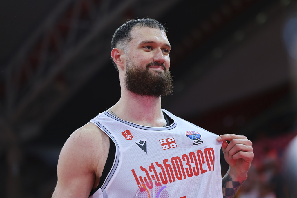 Georgia's Alexander Mamukelashvili celebrates after his team won Spain during the Eurobasket, European Basketball Championship Group C match between Spain and Georgia at the Spyros Kyprianou Arena in Limassol, Cyprus, Thursday, Aug. 28, 2025. (AP Photo/Chara Savvidou)