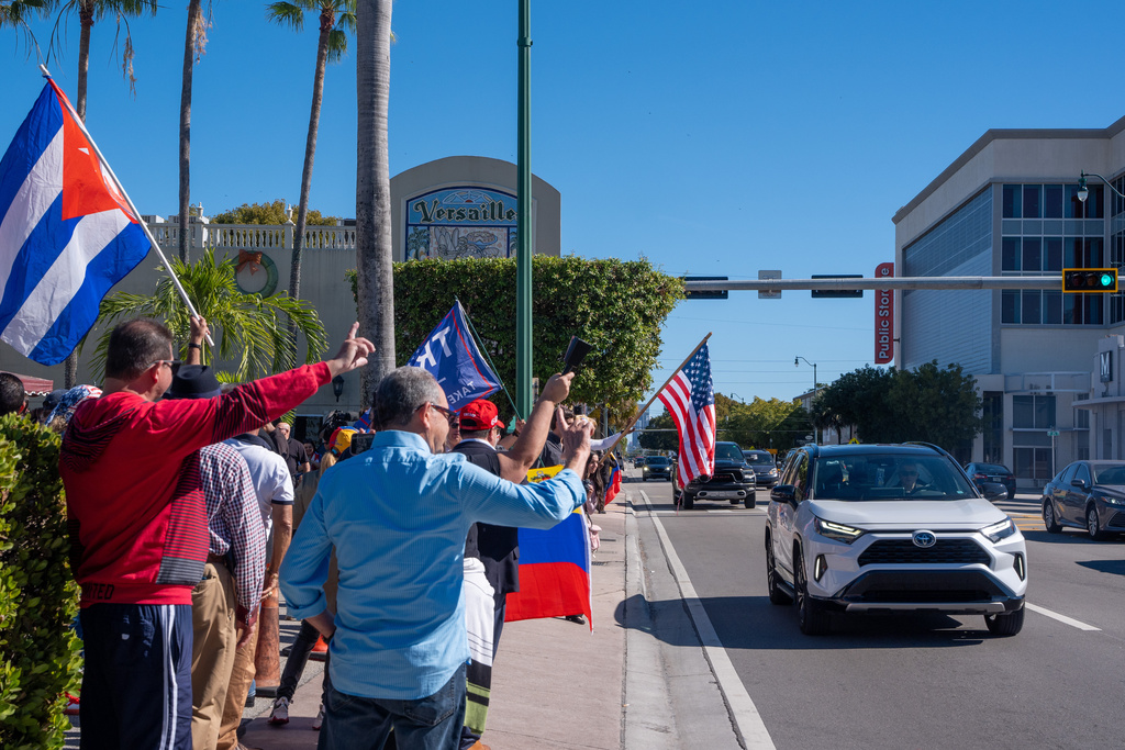 People celebrate outside Versailles Cuban Cuisine after President Donald Trump announced Venezuelan President Nicolás Maduro had been captured and flown out of the country, in Miami, Saturday, Jan. 3, 2026. (AP Photo/Jen Golbeck)