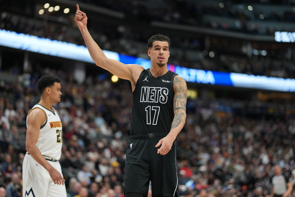 Brooklyn Nets forward Michael Porter Jr. gestures to the bench in the first half of an NBA basketball game against the Denver Nuggets, Thursday, Jan. 29, 2026, in Denver. (AP Photo/David Zalubowski)