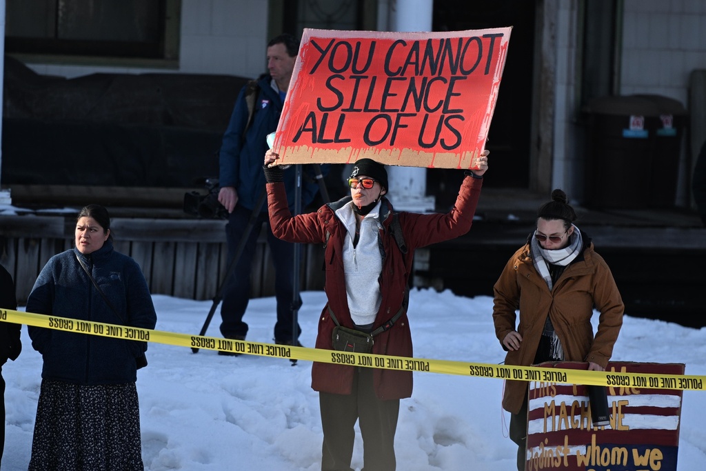 Protesters gather near the scene of the fatal shooting involving federal law enforcement agents, Wednesday, Jan. 7, 2026, in Minneapolis. (AP Photo/Tom Baker)