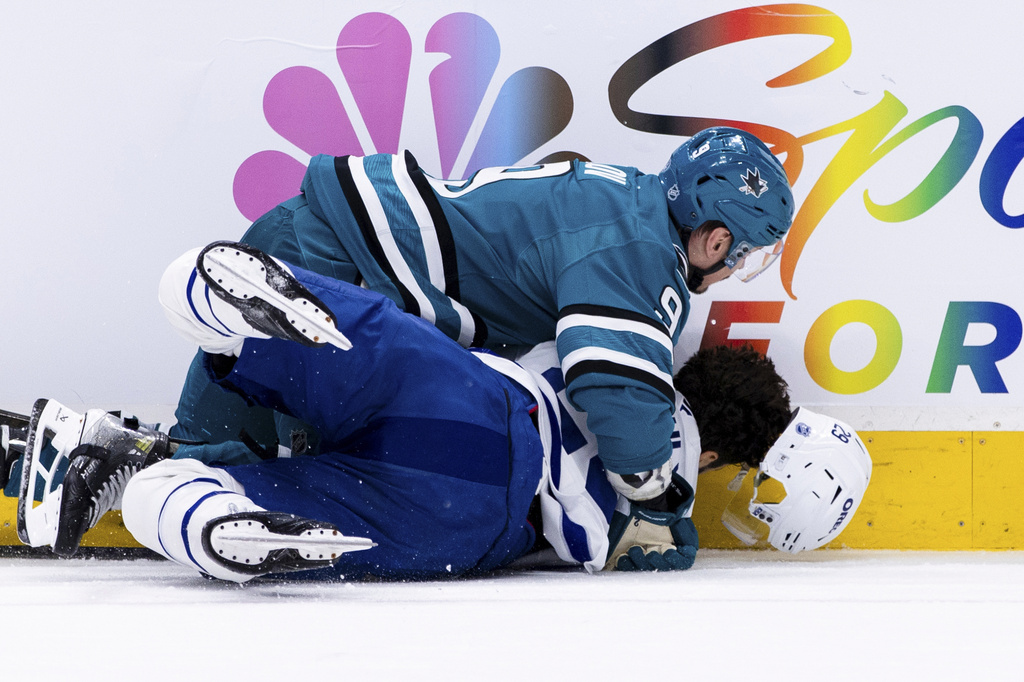 San Jose Sharks defenseman Dmitry Orlov (9) collides with Toronto Maple Leafs center Bo Groulx (29) during the second period of an NHL hockey game in San Jose, Calif., Thursday, April 2, 2026. (AP Photo/John Hefti)