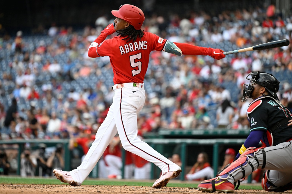 Washington Nationals' CJ Abrams hits a solo home run during the third inning of a baseball game against the Arizona Diamondbacks, Sunday, July 26, 2026, in Washington. (AP Photo/John McDonnell)