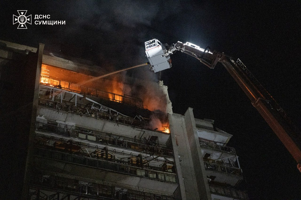 In this photo provided by the Ukrainian Emergency Services on Saturday, April 4, 2026, rescue workers put out a fire of a residential building damaged following a Russian strike in Sumy, Ukraine. (Ukrainian Emergency Service via AP)