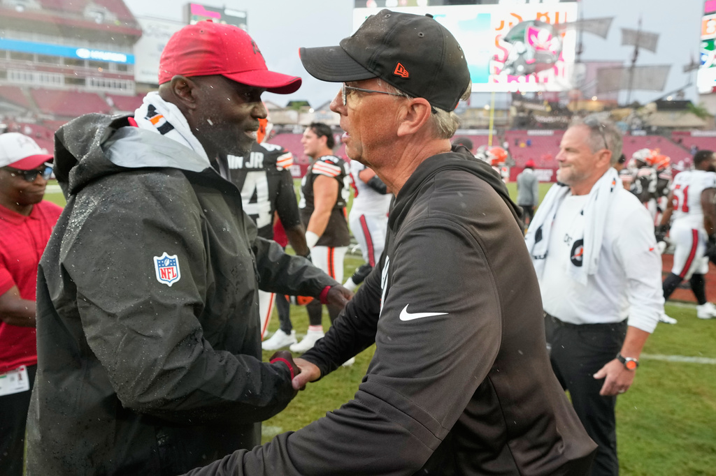Tampa Bay Buccaneers head coach Todd Bowles, left, and Cleveland Browns head coach Todd Monken meet at the end of an NFL football game in Tampa, Fla., Sunday, Sept. 20, 2026. (AP Photo/Chris O'Meara)