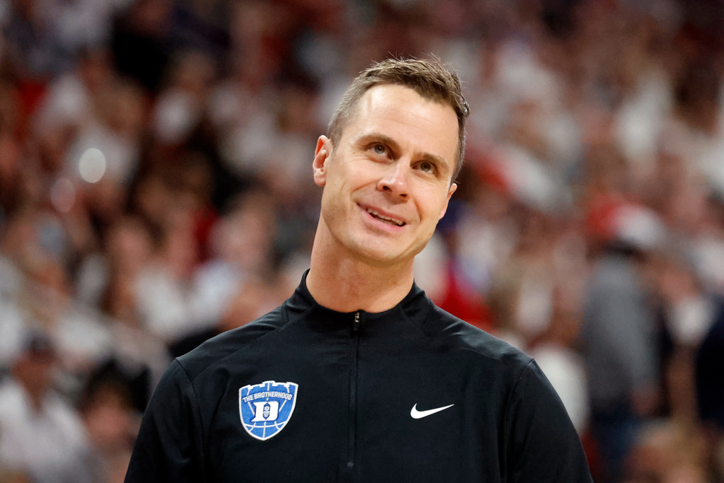 Duke's Jon Scheyer, reacts to the lack of a call during the first half of an NCAA college basketball game against North Carolina State in Raleigh, N.C., Monday, March 2, 2026. (AP Photo/Karl DeBlaker)