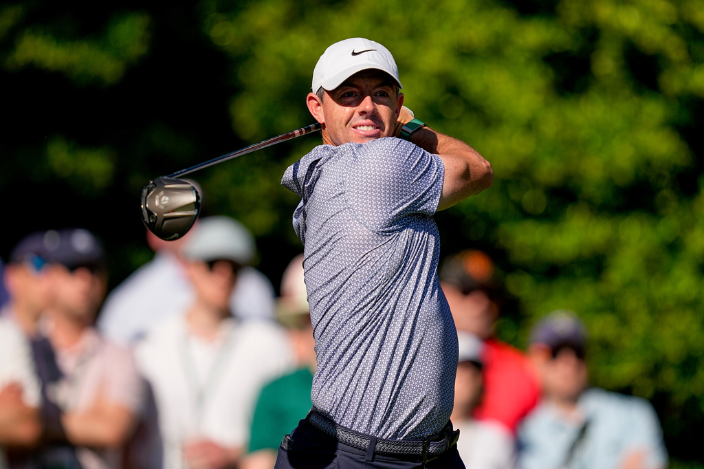 Rory McIlroy, of Northern Ireland, watches his tee shot on the 11th hole during the third round of the Masters golf tournament at the Augusta National Golf Club, Saturday, April 11, 2026, in Augusta, Ga. (AP Photo/David J. Phillip)
