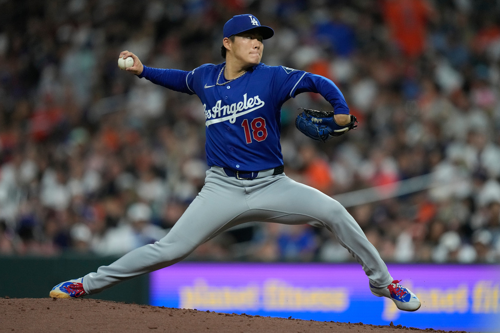 Los Angeles Dodgers starting pitcher Yoshinobu Yamamoto (18) throws during the fourth inning of a baseball game against the Houston Astros in Houston, Monday, May 4, 2026. (AP Photo/Ashley Landis)