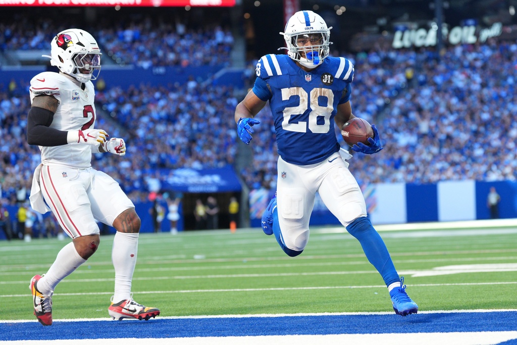 Indianapolis Colts' Jonathan Taylor runs for a touchdown during the second half of an NFL football game against the Arizona Cardinals Sunday, Oct. 12, 2025, in Indianapolis. (AP Photo/AJ Mast)