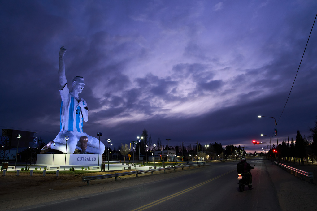 A sculpture of soccer star Lionel Messi by artist Aldo Beroisa, that was unveiled for Argentina's opening World Cup match against Algeria, stands in Cutral Co, Argentina, at sunrise Sunday, June 21, 2026. (AP Photo/Nestor Ponce)