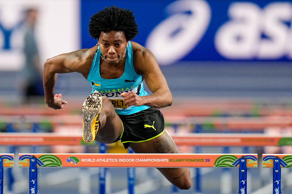 Devynne Charlton, of Bahamas, competes in a women's 60 meters hurdles heat at the World Athletics Indoor Championships in Torun, Poland, Sunday, March 22, 2026. (AP Photo/Petr David Josek)