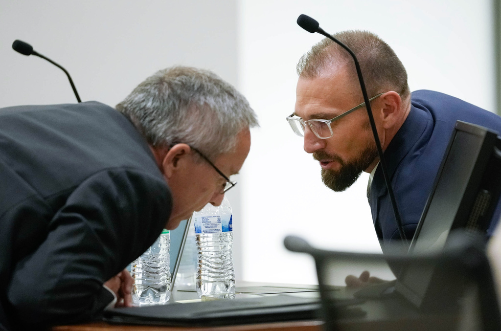Utah County Attorney Jeff Gray, left, and Deputy Utah County Attorney Ryan McBride talk with each other during a hearing for Tyler Robinson, accused in the fatal shooting of Charlie Kirk, in 4th District Court in Provo, Utah, on Friday, June 12, 2026. (Francisco Kjolseth /The Salt Lake Tribune via AP, Pool)