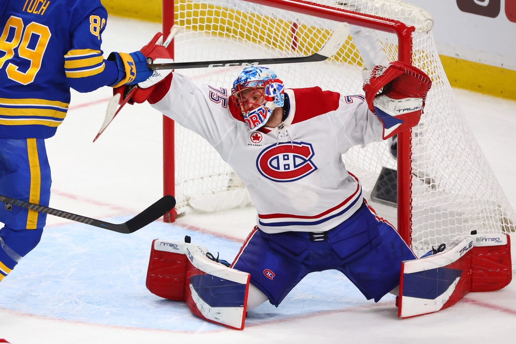Montreal Canadiens goaltender Jakub Dobes makes a save during the third period in Game 5 of a second-round NHL hockey Stanley Cup playoff series against the Buffalo Sabres, Thursday, May 14, 2026, in Buffalo, N.Y. (AP Photo/Jeffrey T. Barnes)