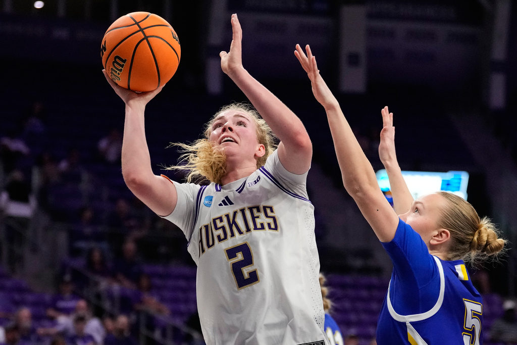 Washington guard Avery Howell (2) shoots as South Dakota State's Ellie Colbeck (5) defends in the first half in the first round of the NCAA college basketball tournament, Friday, March 20, 2026, in Fort Worth, Texas. (AP Photo/Tony Gutierrez)