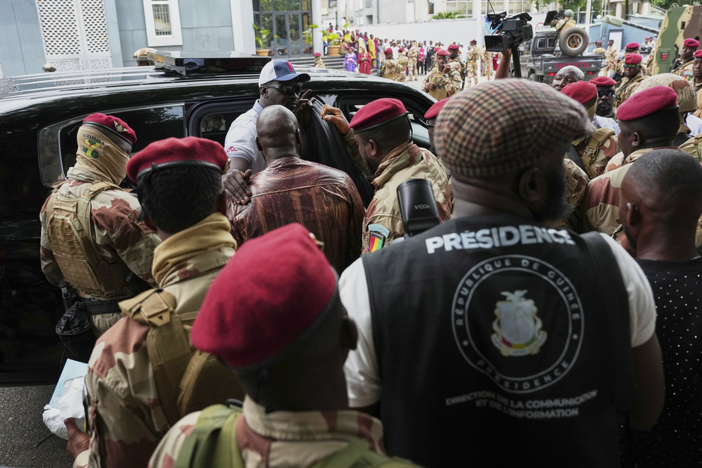 Guinea's interim President, Gen. Mamadi Doumbouya, departs after casting his vote in the constitutional referendum, in Conakry, Guinea, Sunday, Sept. 21, 2025. (AP Photo/Misper Apawu)