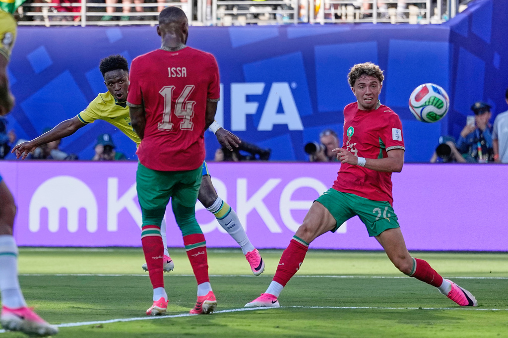Brazil's Vinicius Junior, back left, scores his side's first goal during the World Cup Group C soccer match between Brazil and Morocco in East Rutherford, N.J., near New York, Saturday, June 13, 2026. (AP Photo/Petr David Josek)