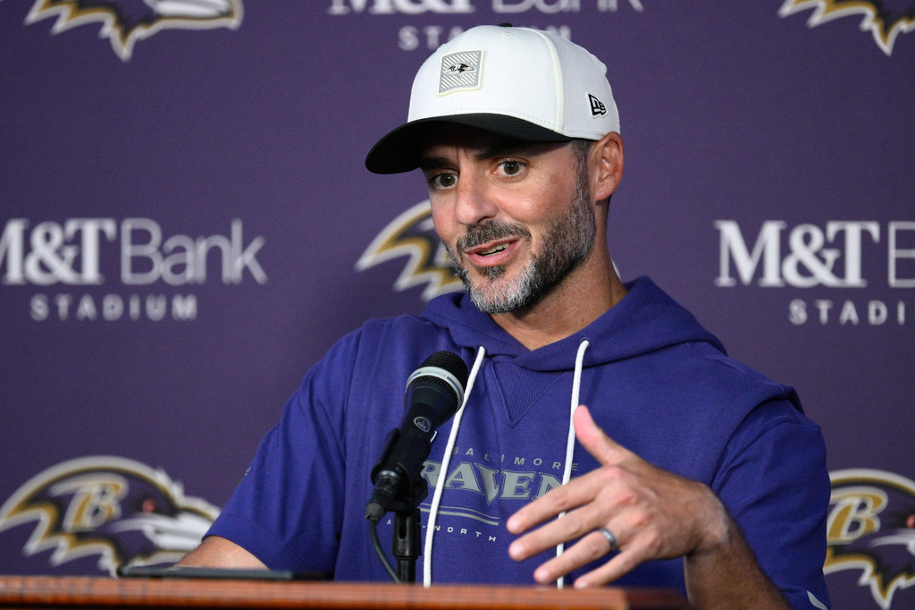 Baltimore Ravens head coach Jesse Minter answers a question after an NFL preseason football game against the Washington Commanders, Friday, Aug. 28, 2026, in Baltimore. (AP Photo/Nick Wass)