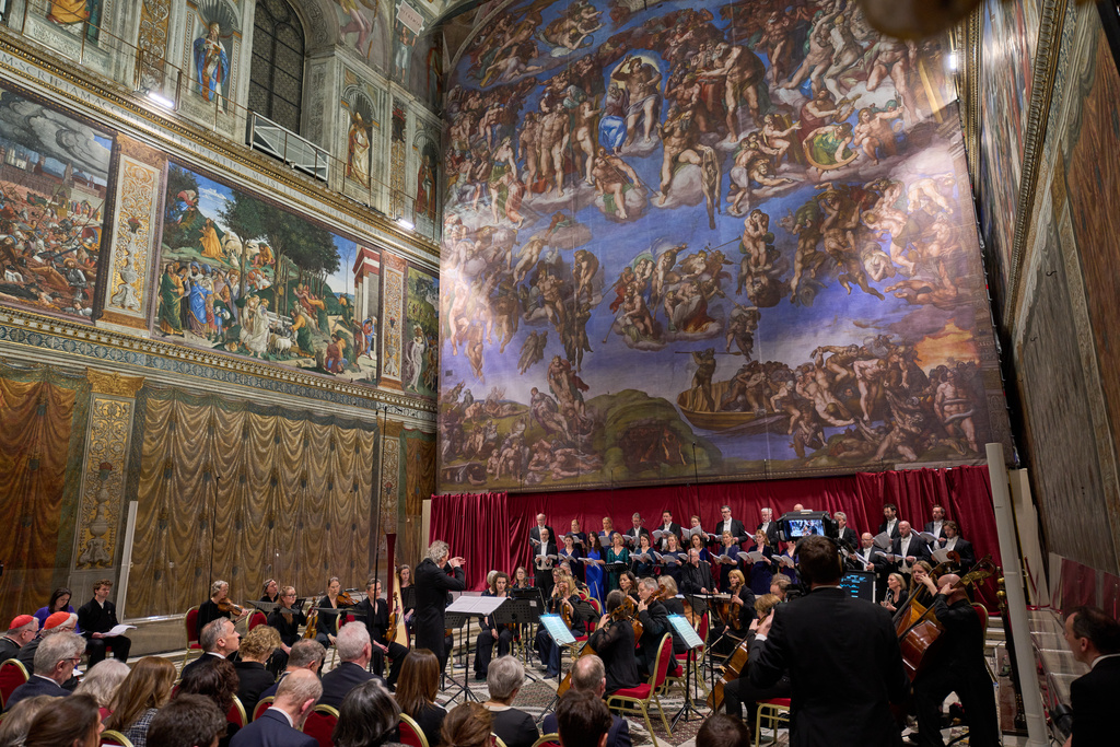 The Sixteen perform Angels Unawares byJames MacMillan, conducted by Harry Christopher in the Sistine Chapel at the Vatican, Sunday, March 22, 2026. (AP Photo/Domenico Stinellis)