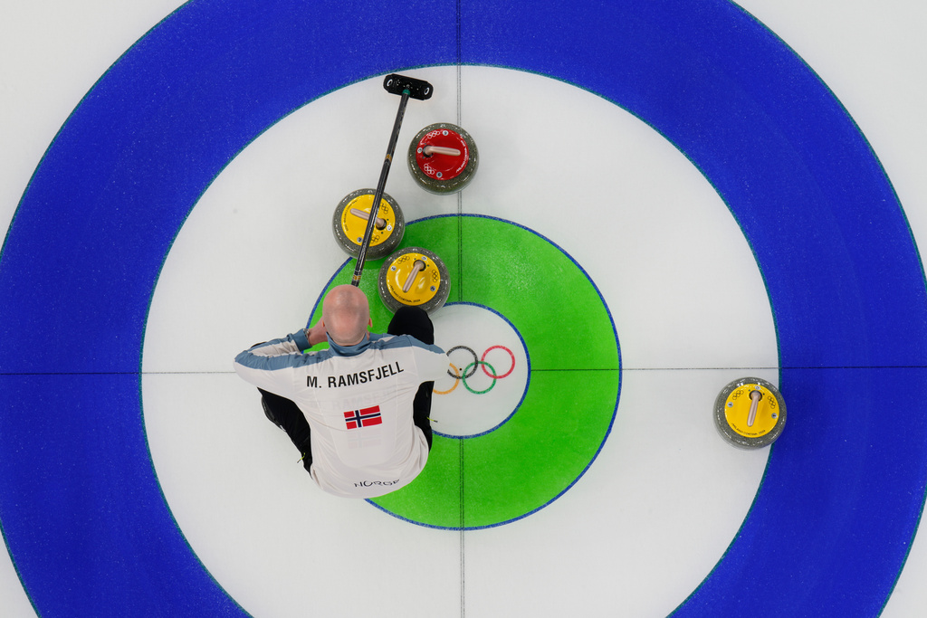 Norway's Magnus Ramsfjell looks over the stones during a men's curling round robin match against China at the 2026 Winter Olympics, in Cortina d'Ampezzo, Italy, Friday, Feb. 13, 2026. (AP Photo/David J. Phillip)