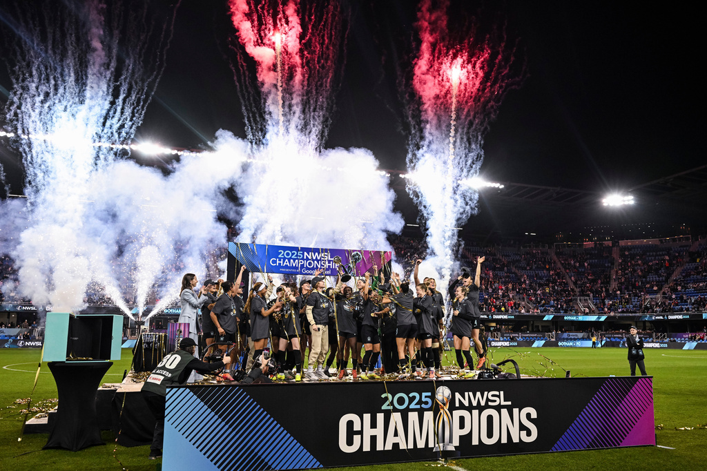FILE - NJ/NY Gotham FC lift the NWSL championship trophy after defeating the Washington Spirit in a NWSL women's championship soccer match, Nov. 22, 2025, in San Jose, Calif. (AP Photo/Justine Willard, File)