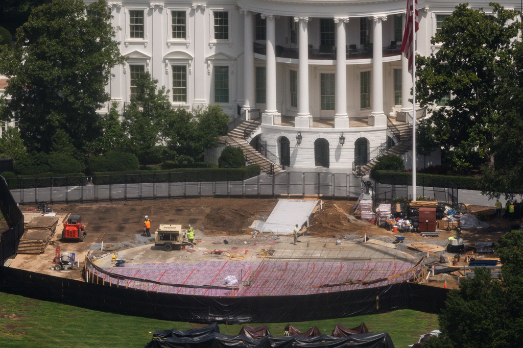 Construction continues on a helipad on the South Lawn of the White House, Wednesday, Aug. 5, 2026, in Washington. (AP Photo/Tierney L. Cross)
