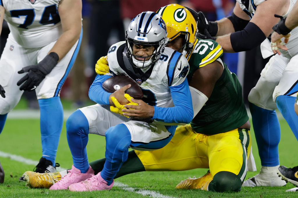 Green Bay Packers defensive end Dani Dennis-Sutton (51) sacks Carolina Panthers quarterback Bryce Young (9) during the second half of an NFL football game in Green Bay, Wis., Thursday, Oct. 29, 2026. (AP Photo/Matt Ludtke)