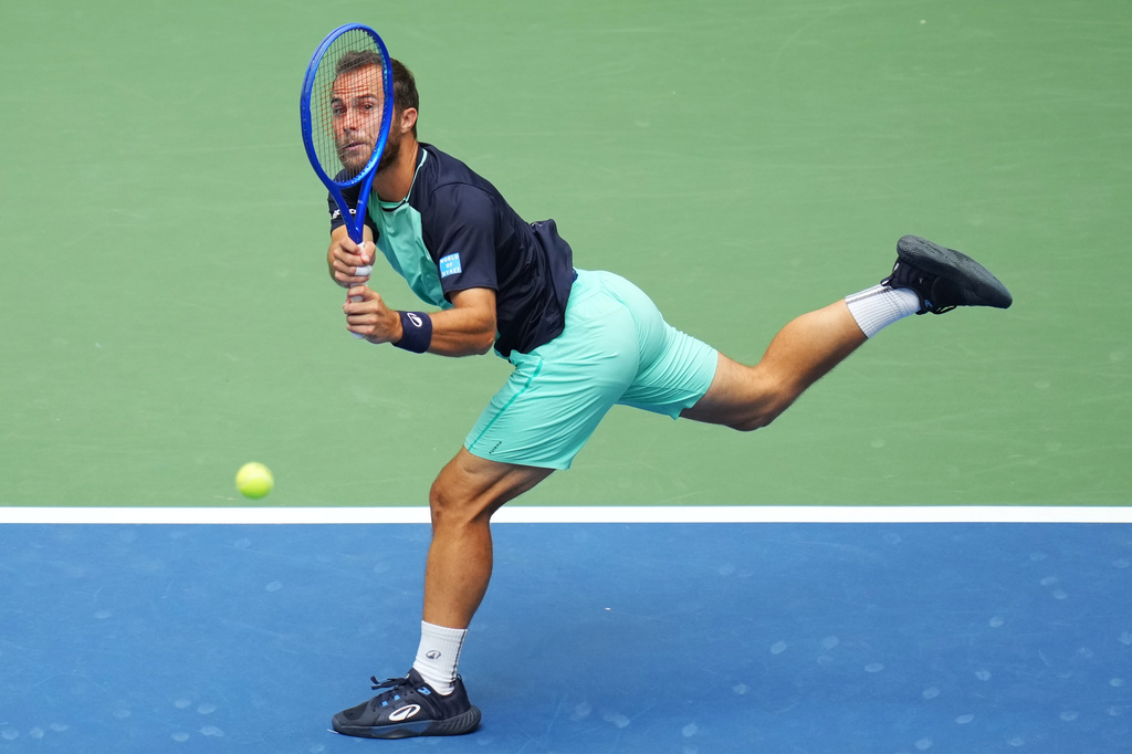 Hugo Gaston, of France, returns the ball to Daniil Medvedev, of Russia, during the first round of the U.S. Open tennis championships Sunday, Aug. 30, 2026, in New York. (AP Photo/Kirsty Wigglesworth)