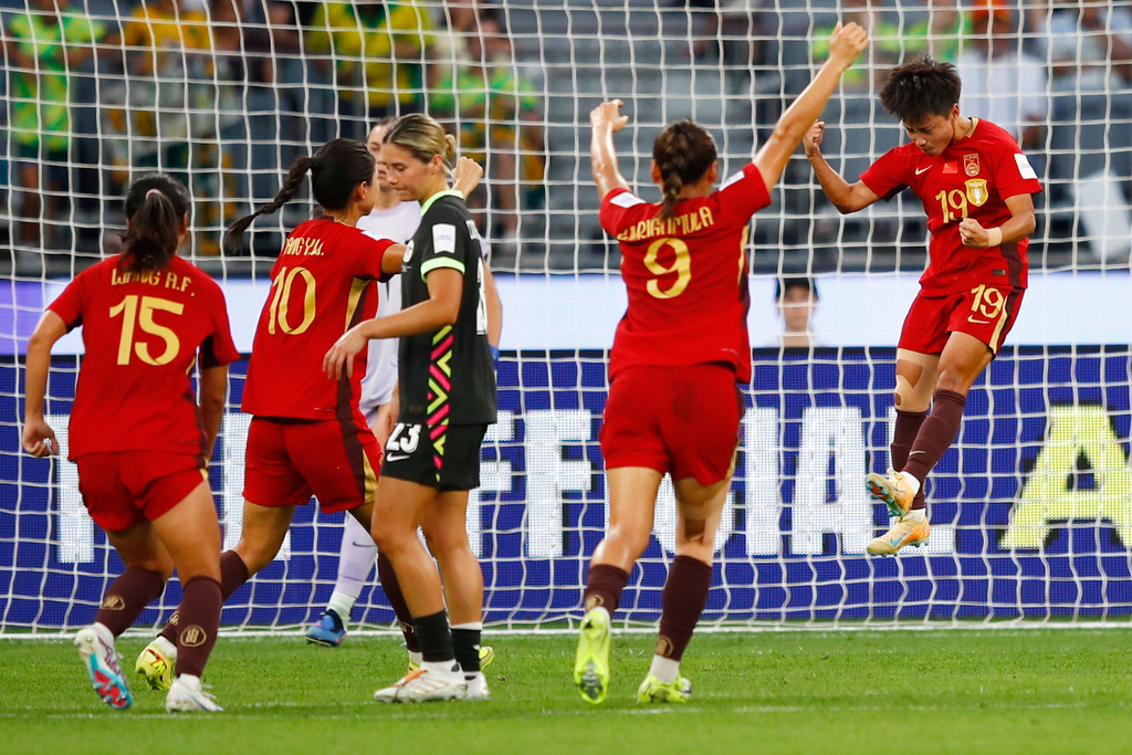 China's Zhang Linyan, right, celebrates after scoring her team's fourth goal from a penalty during the Women's Asian Cup semifinal soccer match between China and Australia in Perth, Australia, Tuesday, March 17, 2026. (AP Photo/Gary Day)