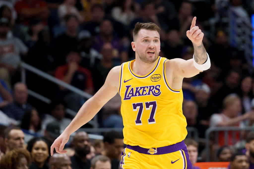 Los Angeles Lakers forward/guard Luka Dončić (77) reacts during the first half of an NBA basketball game against the New Orleans Pelicans in New Orleans, Tuesday, Jan. 6, 2026. (AP Photo/Matthew Hinton)