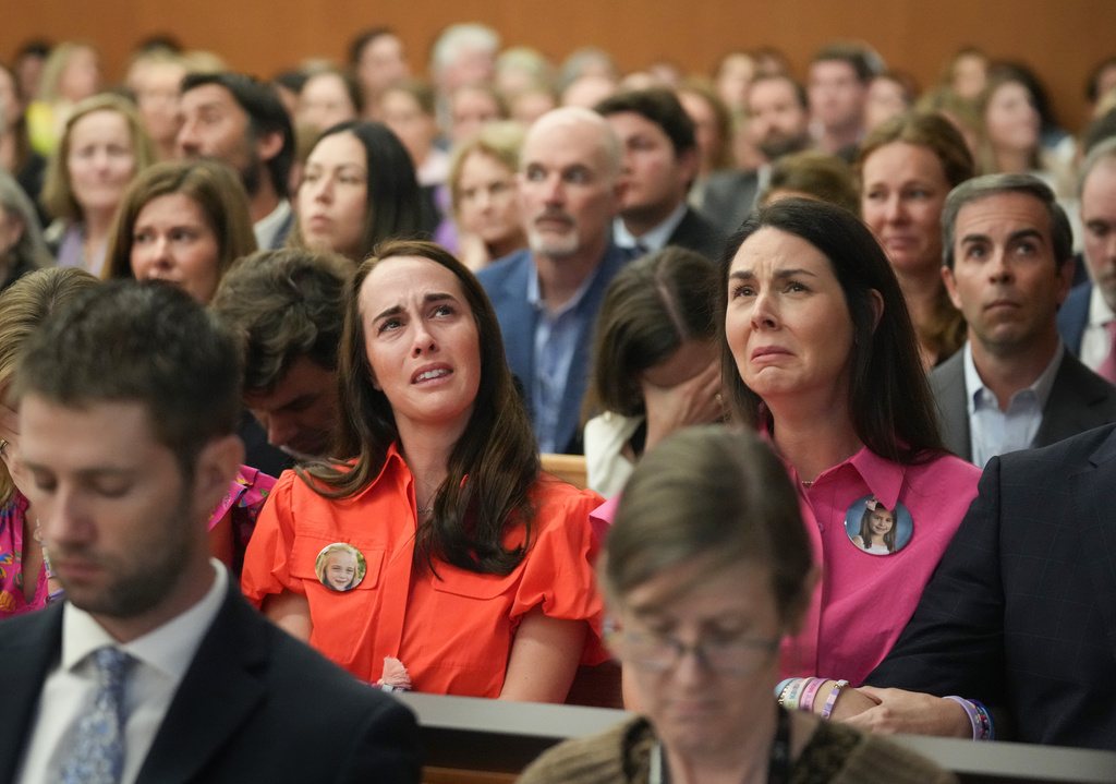 Alli Naylor, center left, mother of Wynne Naylor, and Malorie Lytal, center right, mother of Kellanne Lytal, attend a hearing about a temporary restraining order for Camp Mystic, at the Travis County Courthouse in Austin, Texas, on Wednesday, March 4, 2026. (Jay Janner/Austin American-Statesman via AP, Pool)