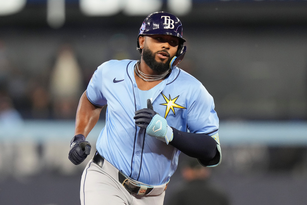 Tampa Bay Rays' Junior Caminero (13) rounds the bases after hitting a solo home run off Toronto Blue Jays pitcher Shane Bieber during second inning MLB baseball action in Toronto on Friday, Sept. 26, 2025. (Chris Young/The Canadian Press via AP)
