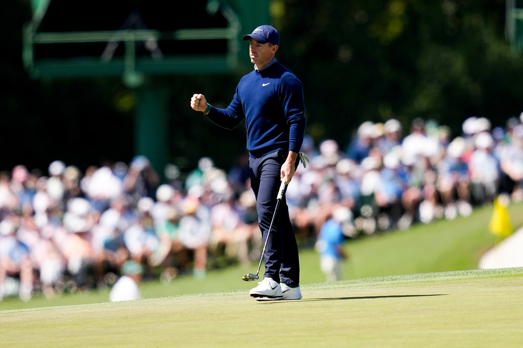 Rory McIlroy, of Northern Ireland, celebrates after a birdie on the 15th hole during the first round of the Masters golf tournament at the Augusta National Golf Club, Thursday, April 9, 2026, in Augusta, Ga. (AP Photo/David J. Phillip)