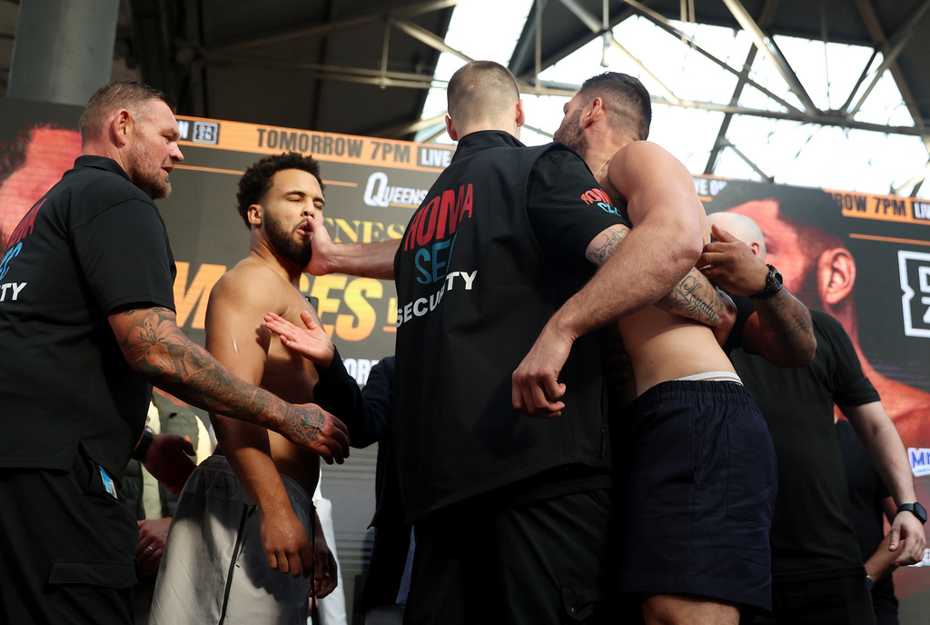 Boxer Filip Hrgovic, right, slaps Moses Itauma during the weigh-in Friday, Aug. 28, 2026, in London, ahead of their IBF heavyweight championship bout. (Steven Paston/PA via AP)