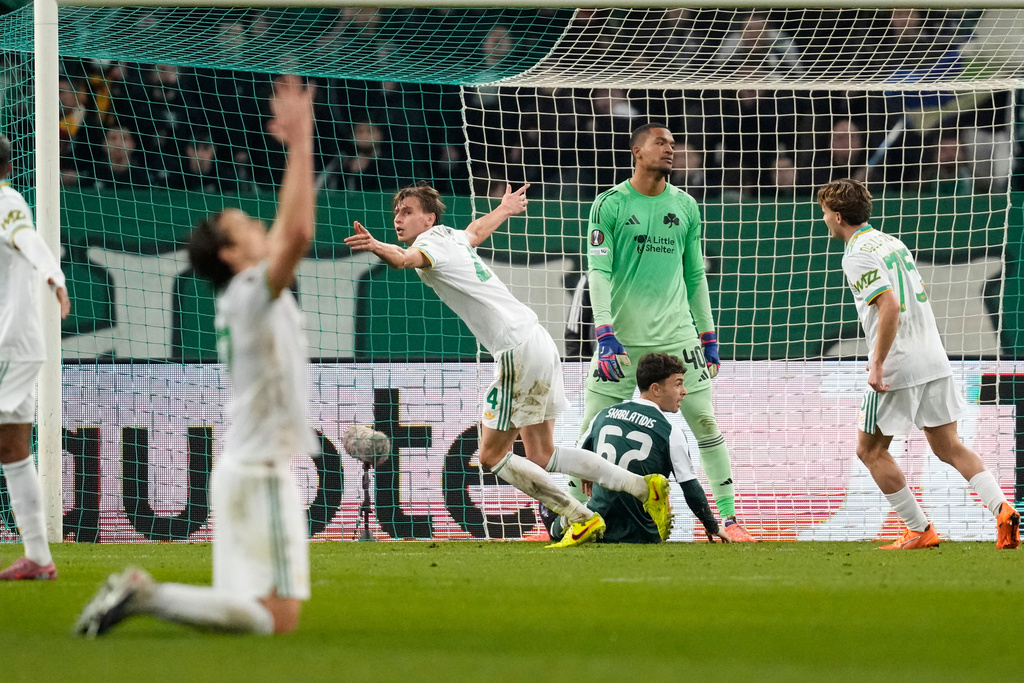 Roma's Jan Ziolkowski, center, celebrates after he scored his side's first goal during an Europa League soccer match between Panathinaikos and Roma, in Athens, Greece, Thursday, Jan. 29, 2026. (AP Photo/Petros Giannakouris)