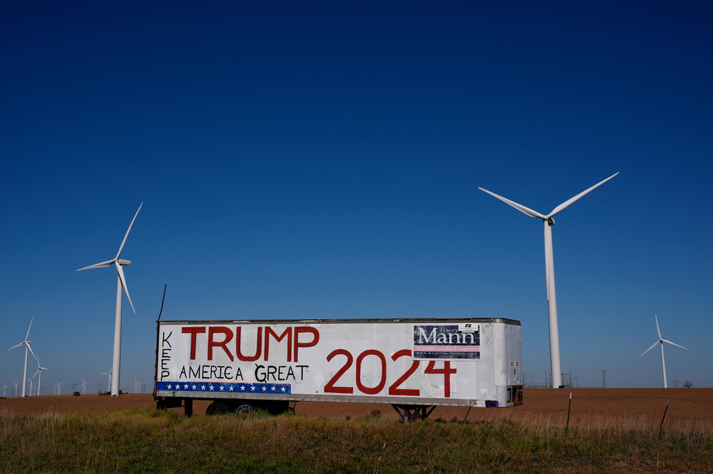 FILE - A trailer with a sign supporting President Donald Trump stands adjacent to the Smoky Hills wind farm, Sept. 30, 2024, near Ellsworth, Kan. (AP Photo/Charlie Riedel, file)