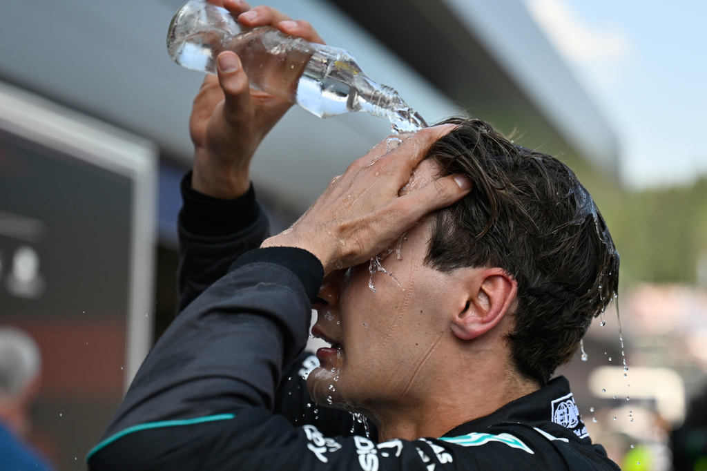 Race winner Mercedes driver George Russell of Britain refreshes himself after the Austrian F1 Grand Prix, in Spielberg, Austria, Sunday, June 28, 2026. (AP Photo/Denes Erdos)