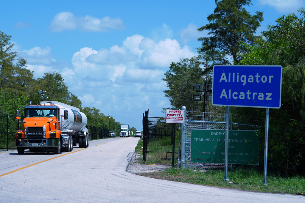 FILE - Trucks come and go from the "Alligator Alcatraz" immigration detention center in the Florida Everglades, Thursday, Aug. 28, 2025, in Collier County, Fla. (AP Photo/Rebecca Blackwell,File)