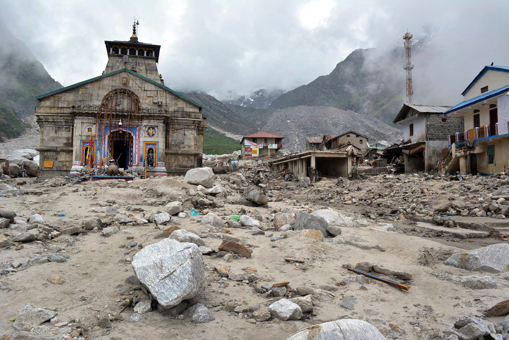 FILE -In this June 20, 2013, photo, the Kedarnath shrine, one of the holiest Hindu temples, and other buildings around it are seen damaged following monsoon rains in northern India. (AP Photo, File)