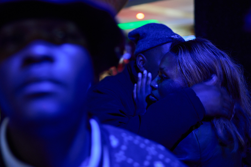 FILE - A man embraces a woman inside a club in Maseru, Lesotho, July 20, 2025. (AP Photo/Bram Janssen, File)